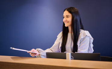A lady with a report on her hand
